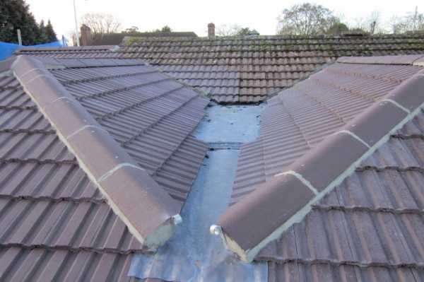 This shows both pitch roofs with tiling completed
